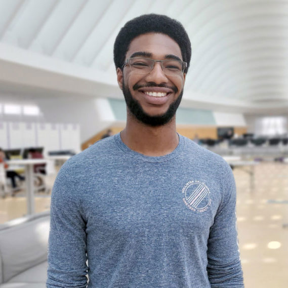Dark skinned male student.